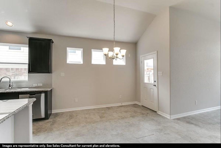 The bright dining area sits just off the kitchen, offering the perfect space for casual meals or hosting guests while enjoying the seamless open concept flow of the home. **Photos are representative only and may vary as built. **