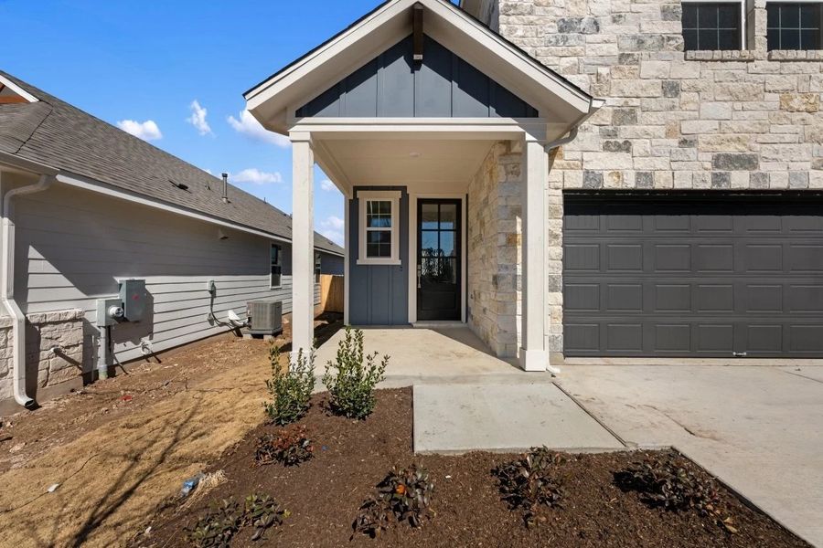 Exterior details and patio area of a home in Cannon Ranch, Dripping Springs (Image 3).