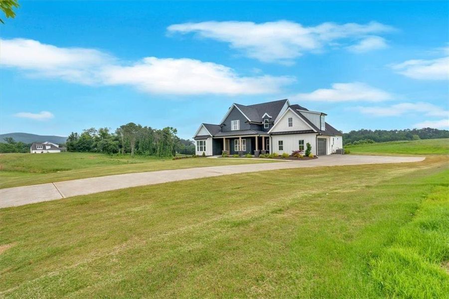 Front exterior of a new home in , Rydal, GA, highlighting curb appeal (Image 2). Front exterior of a new home in , Rydal, GA, highlighting curb appeal (Image 2).