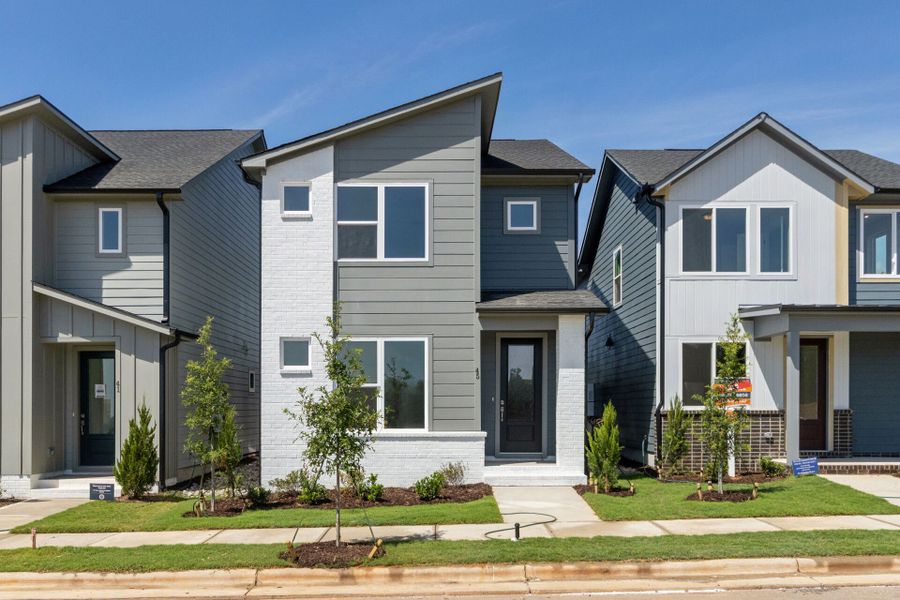 Front exterior of a new home in NoVi Chatham Park - The Mews Collection, Pittsboro, NC, highlighting curb appeal (Image 2). Front exterior of a new home in NoVi Chatham Park - The Mews Collection, Pittsboro, NC, highlighting curb appeal (Image 2).