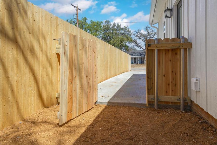 View of yard with fence and a patio View of yard with fence and a patio