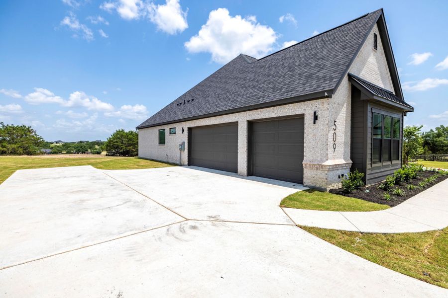Front exterior of a new home in Vintage Oaks, Weatherford, TX, highlighting curb appeal (Image 7).