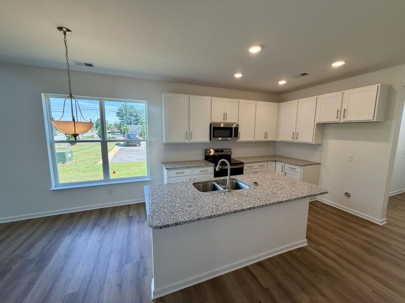 Furnished interior view inside a new home in Bellevue Townhomes, Greenville (Image 5).