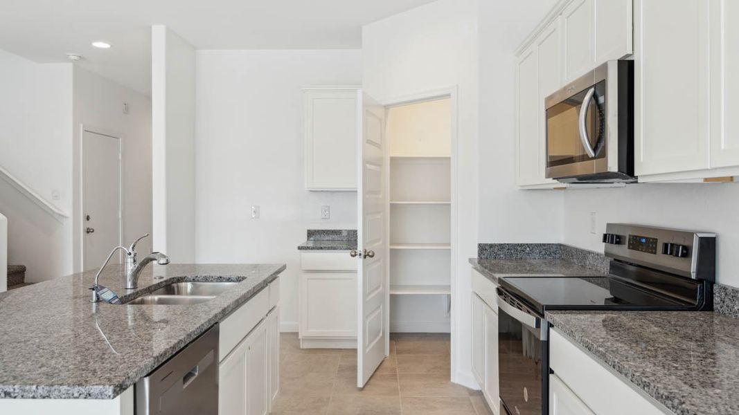 Representative furnished interior of a home built from the Mitchell by D.R. Horton in Upper Canyon, Phoenix (Image 9).