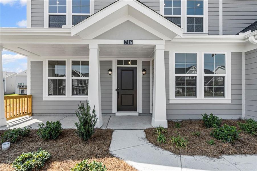 Front exterior of a new home in Twin Lakes, Hoschton, GA, highlighting curb appeal (Image 22). Front exterior of a new home in Twin Lakes, Hoschton, GA, highlighting curb appeal (Image 22).