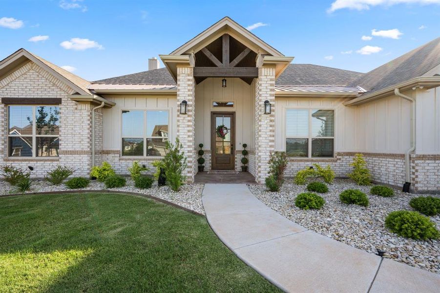 Front exterior of a new home in Pecan Plantation, Granbury, TX, highlighting curb appeal (Image 21).