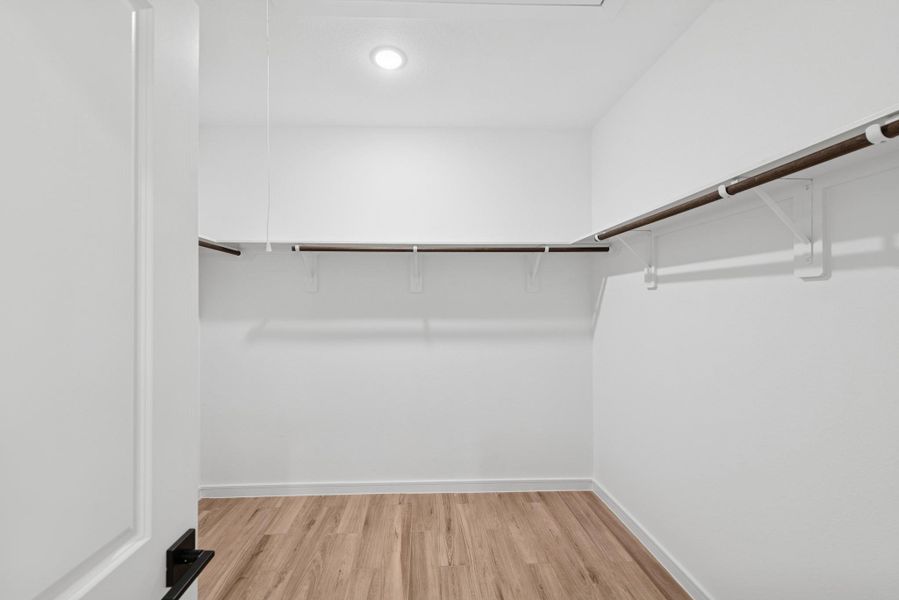 Primary walk-in closet Primary walk-in closet