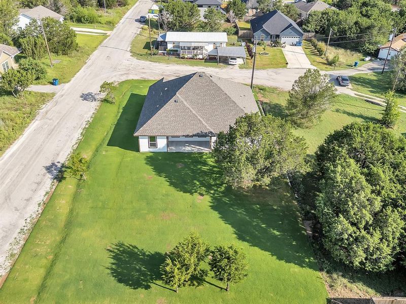 Front exterior of a new home in , Granbury, TX, highlighting curb appeal (Image 23). Front exterior of a new home in , Granbury, TX, highlighting curb appeal (Image 23).