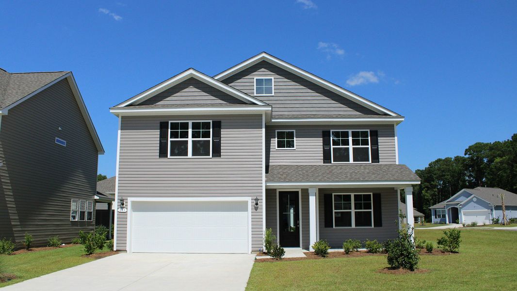 Representative exterior photo of a completed home built from the TILLMAN by D.R. Horton in The Bluffs at Mill Creek, Florence, SC (Image 1).