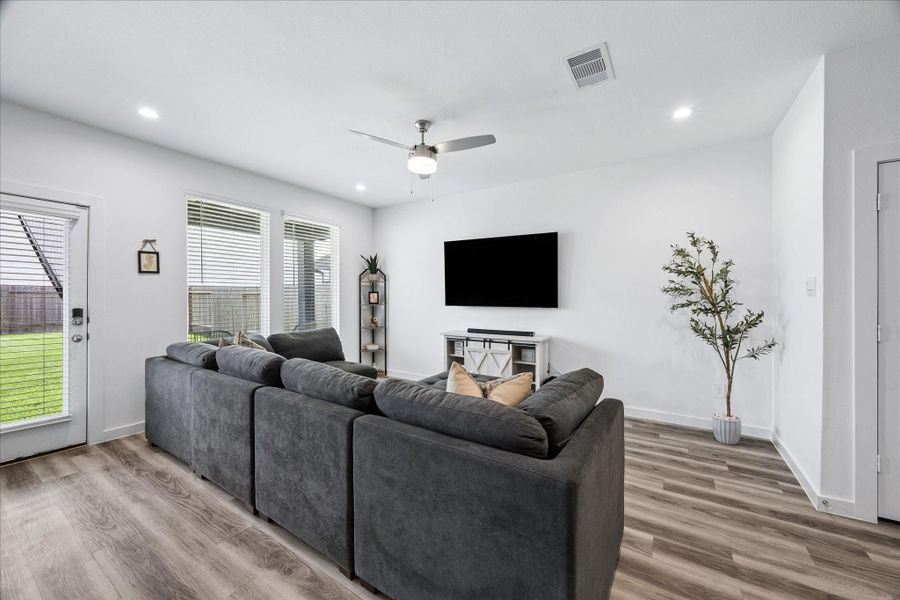 Great space for TV watching and open to the covered patio and fenced backyard for indoor-outdoor living. Great space for TV watching and open to the covered patio and fenced backyard for indoor-outdoor living.