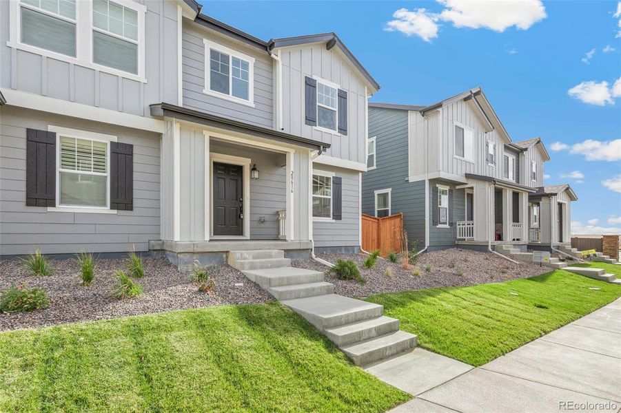 Exterior details and patio area of a home in Sky Ranch Villas, Watkins (Image 23).