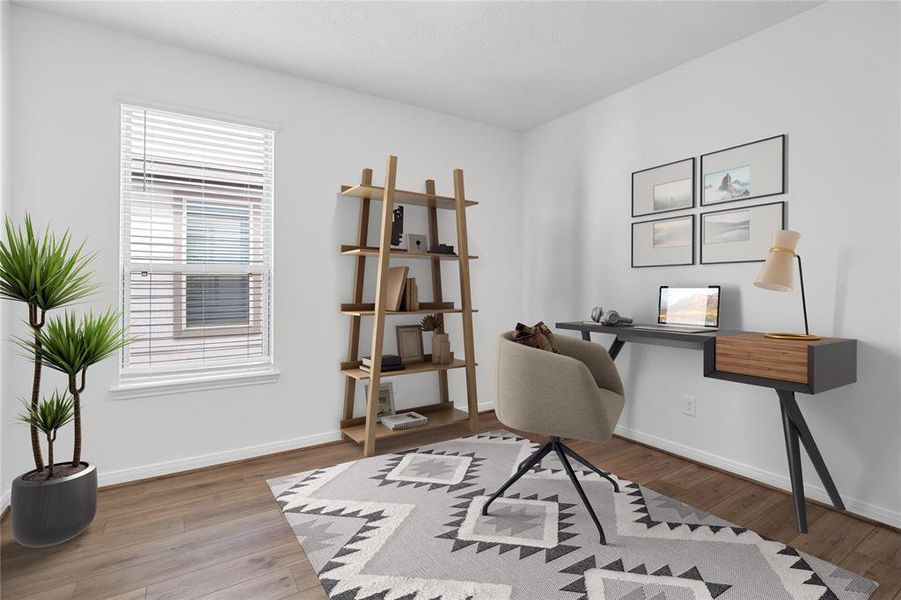 Quietly nestled in front of the home is the handsome home office or formal dining room. Featuring gorgeous vinyl plank flooring, custom paint and a large window with privacy blinds.