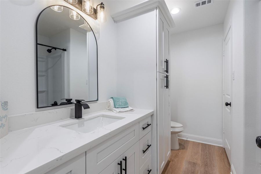 Primary bathroom with large vanity, Quartz counter tops with undermount sink, and soft closing cabinets and drawers.