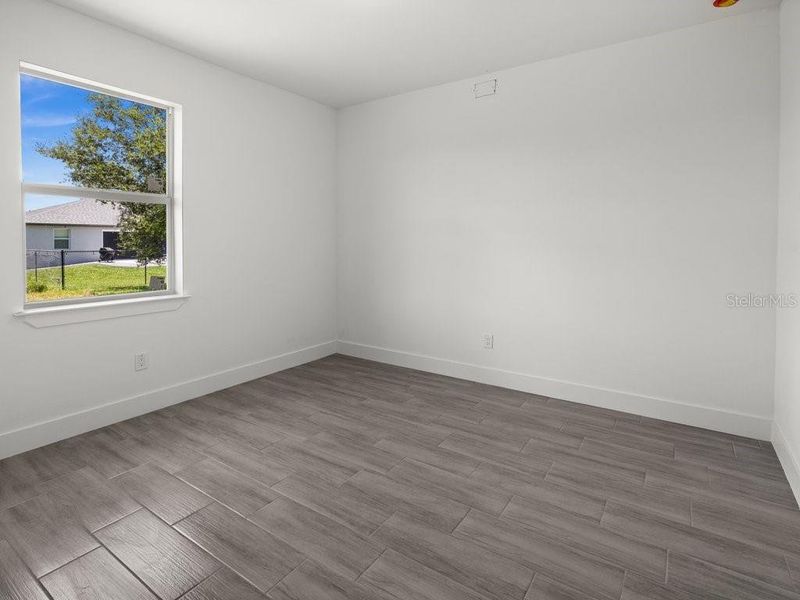 Spacious, unfurnished interior of a new home in , Port Charlotte (Image 29).