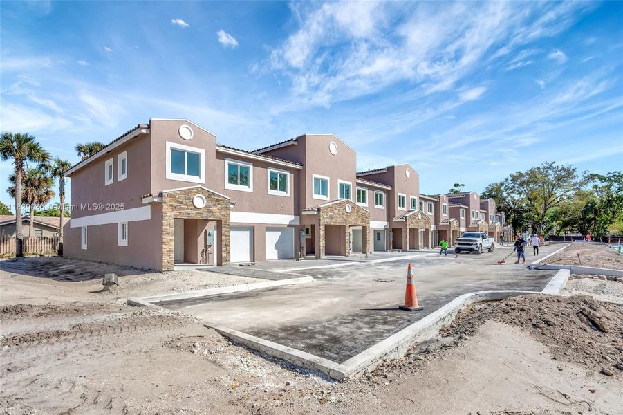 Front exterior of a new home in , Coral Springs, FL, highlighting curb appeal (Image 24).