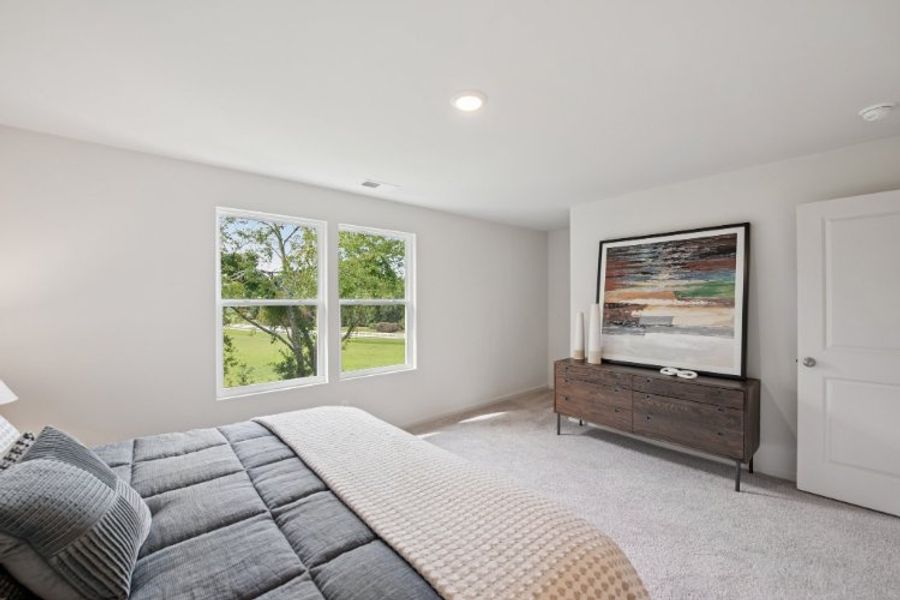 A room with a bed and a window.