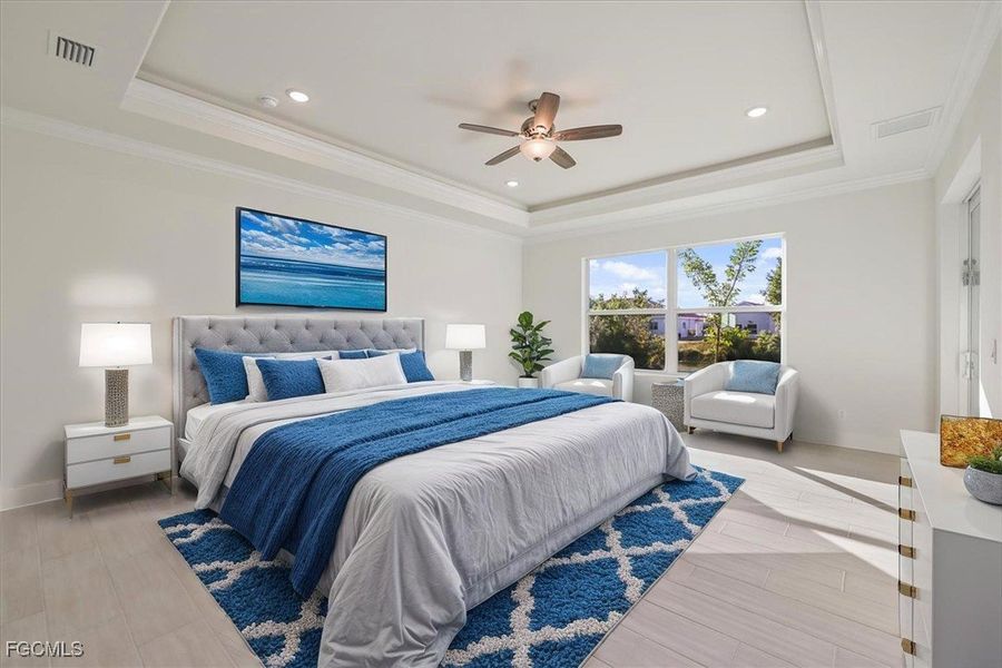 Bedroom with ornamental molding, light wood-style flooring, ceiling fan, a raised ceiling, and recessed lighting