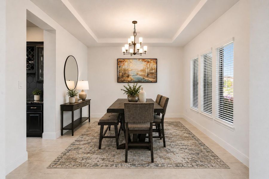 Formal dining area feeds into the bar/butlers pantry and then into the kitchen. -Photo has been virtually altered to help viewer with perspective