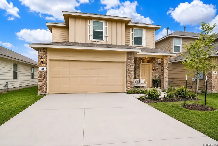 Front exterior of a new home in The Links at River Bend, Floresville, TX, highlighting curb appeal (Image 24). Front exterior of a new home in The Links at River Bend, Floresville, TX, highlighting curb appeal (Image 24).