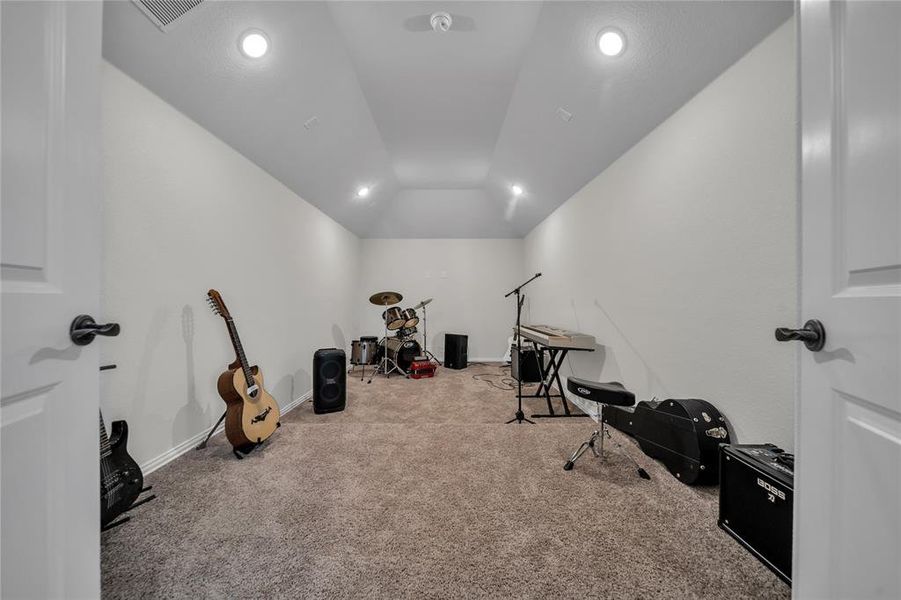 Media room with carpet, recessed lighting, and lofted ceiling Media room with carpet, recessed lighting, and lofted ceiling