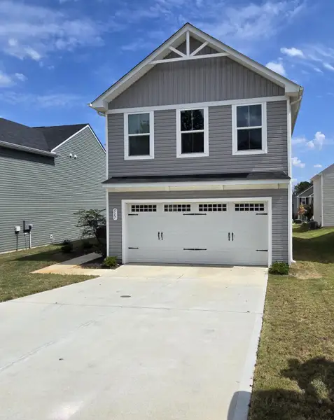 Front exterior of a new home in , Greenville, SC, highlighting curb appeal (Image 1).