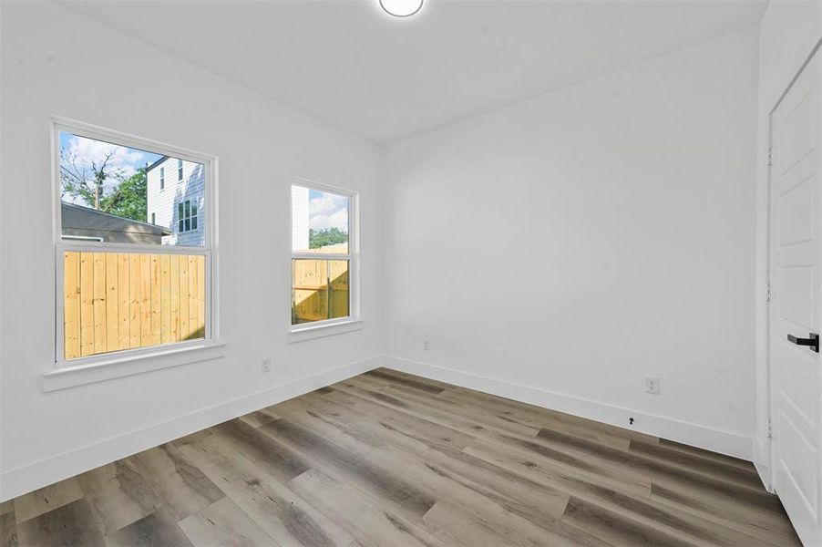 Spare room featuring hardwood / wood-style flooring