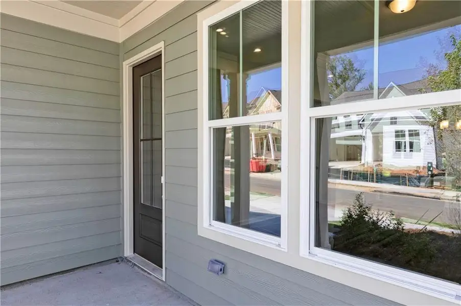 Exterior details and patio area of a home in Madison at Buice Lake, Acworth (Image 3).