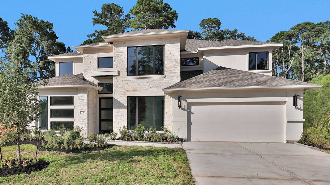 Front exterior of a new home in The Woodlands Hills, Willis, TX, highlighting curb appeal (Image 1). Front exterior of a new home in The Woodlands Hills, Willis, TX, highlighting curb appeal (Image 1).