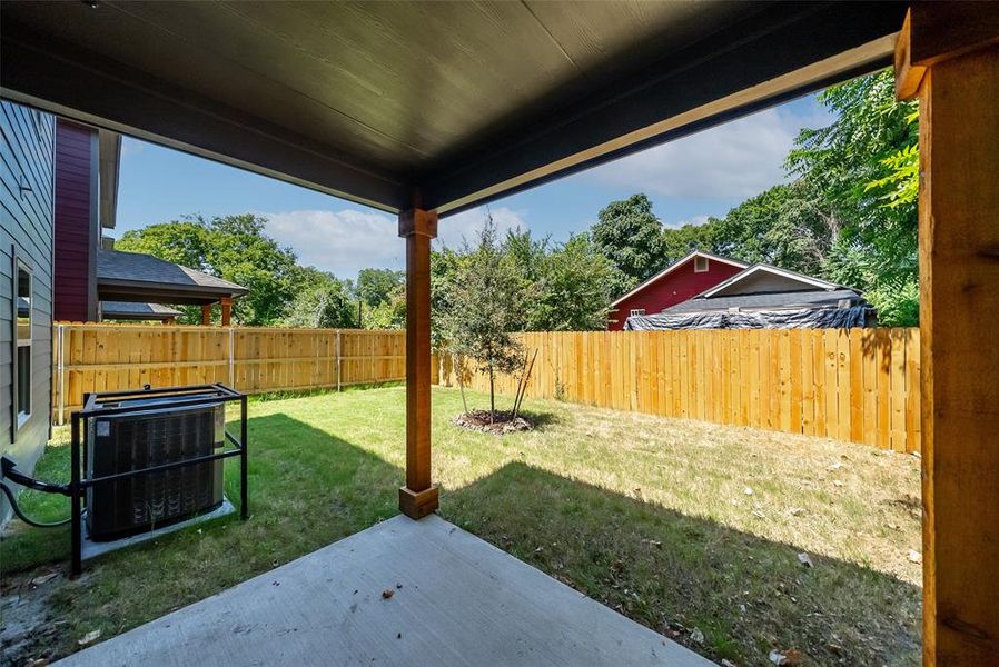 View of yard featuring central air condition unit and a patio