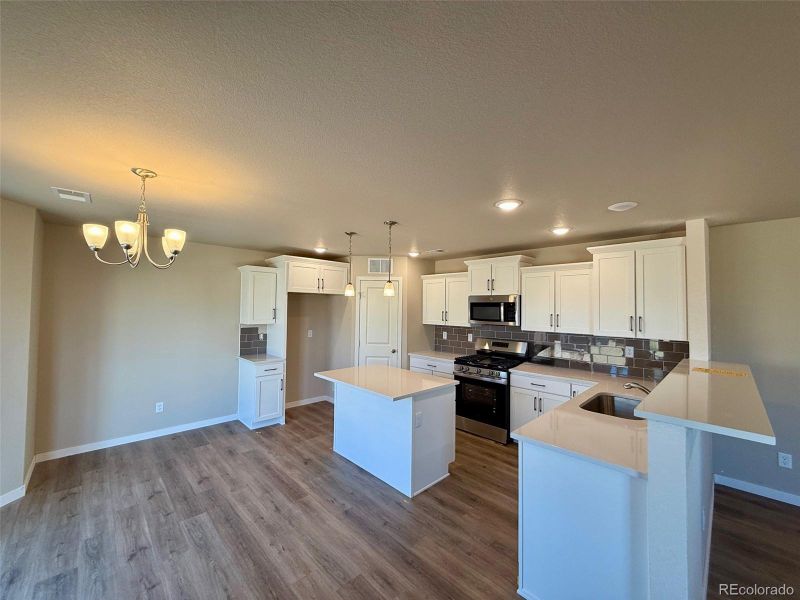 Furnished interior view inside a new home in Sky Ranch - Highland Collection, Watkins (Image 6).