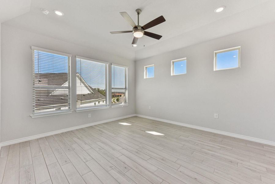 Unfurnished room with recessed lighting, light wood-type flooring, and a ceiling fan Unfurnished room with recessed lighting, light wood-type flooring, and a ceiling fan