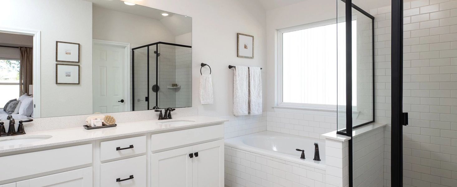 Representative furnished interior of a home built from the Medina II by Ashton Woods in The Colony 50s, Bastrop (Image 10).