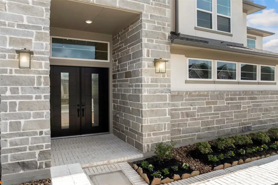 Exterior details and patio area of a home in Bridgeland 80′, Cypress (Image 3).