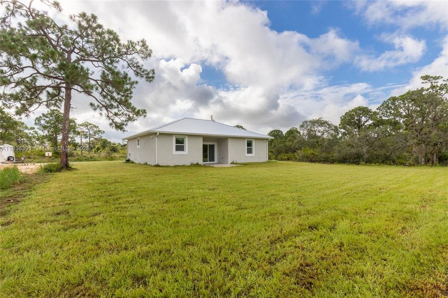 Front exterior of a new home in , Lake Placid, FL, highlighting curb appeal (Image 24).