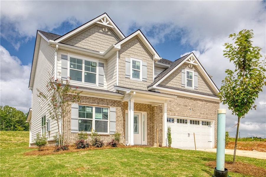 Front exterior of a new home in Neely Farm, Covington, GA, highlighting curb appeal (Image 2). Front exterior of a new home in Neely Farm, Covington, GA, highlighting curb appeal (Image 2).