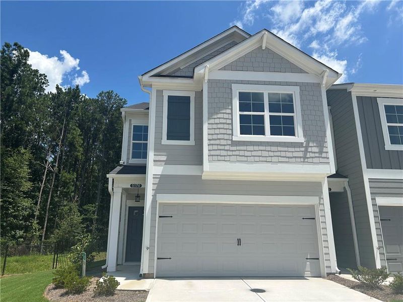 Front exterior of a new home in Longview Run, Decatur, GA, highlighting curb appeal (Image 1).