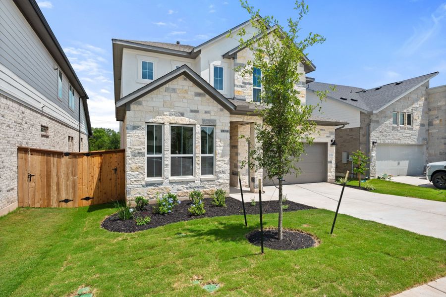 Front exterior of a new home in Heritage, Dripping Springs, TX, highlighting curb appeal (Image 29).