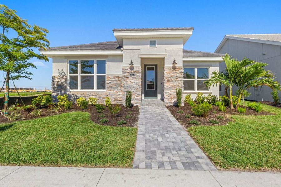 Representative exterior photo of a completed home built from the The Mapleton by David Weekley Homes in Vistera of Venice – Cottage Series, Nokomis, FL (Image 3). Representative exterior photo of a completed home built from the The Mapleton by David Weekley Homes in Vistera of Venice – Cottage Series, Nokomis, FL (Image 3).