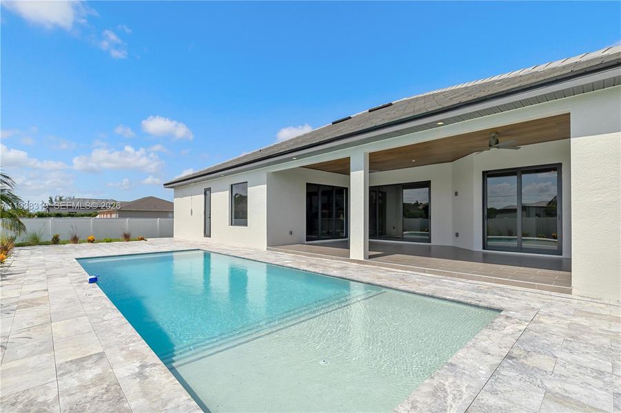 Enjoy outdoor living with a spacious rectangular pool, perfect for relaxing and entertaining in the Southwest Florida lifestyle.