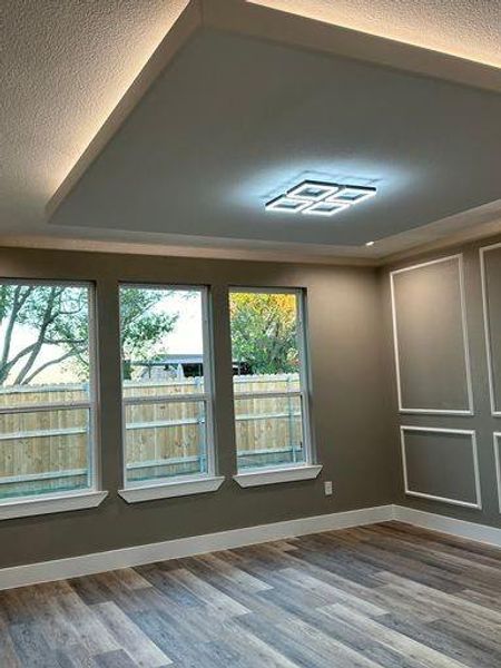 Master room with wood-type flooring and a textured ceiling