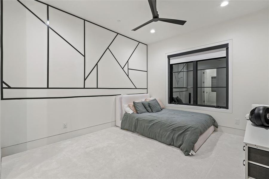 Carpeted bedroom featuring a ceiling fan and recessed lighting Carpeted bedroom featuring a ceiling fan and recessed lighting
