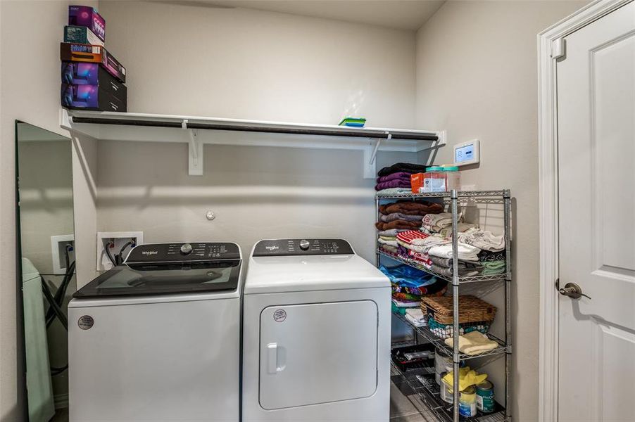 Laundry room featuring separate washer and dryer