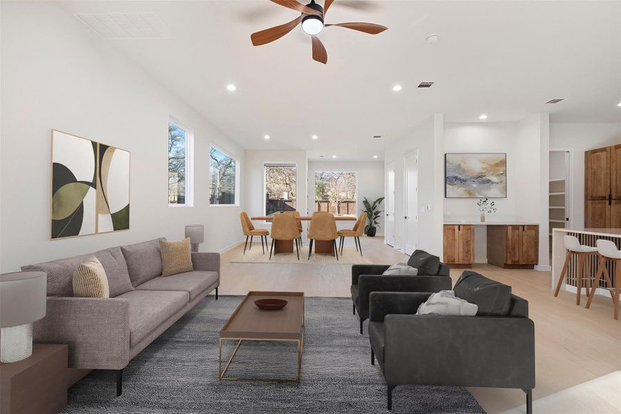 Living area featuring a ceiling fan and recessed lighting