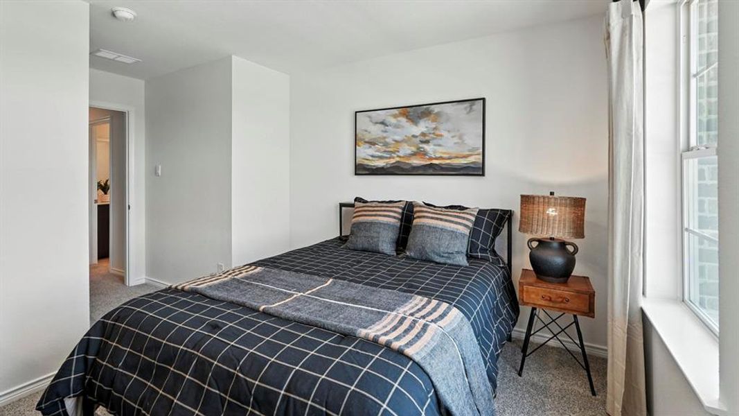 Bedroom with carpet and baseboards