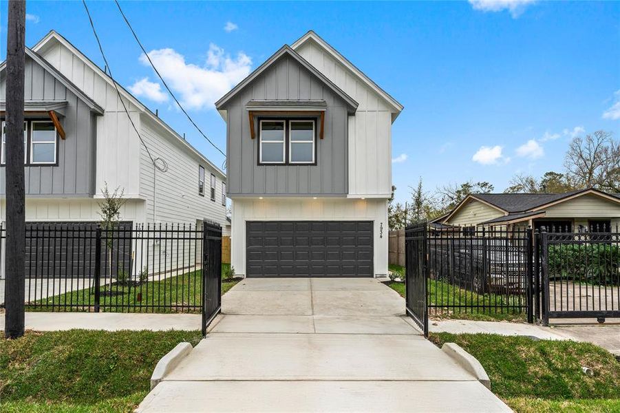 Your tour begins with these stunning brand-new homes, where modern design meets thoughtful details, including sleek black garages and grey accents. (Photo may be enhanced)