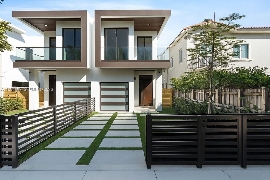 Front exterior of a new home in , Miami, FL, highlighting curb appeal (Image 1). Front exterior of a new home in , Miami, FL, highlighting curb appeal (Image 1).