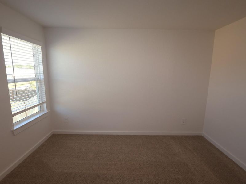 Spacious, unfurnished interior of a new home in Pinewood at Grand Texas, New Caney (Image 8).