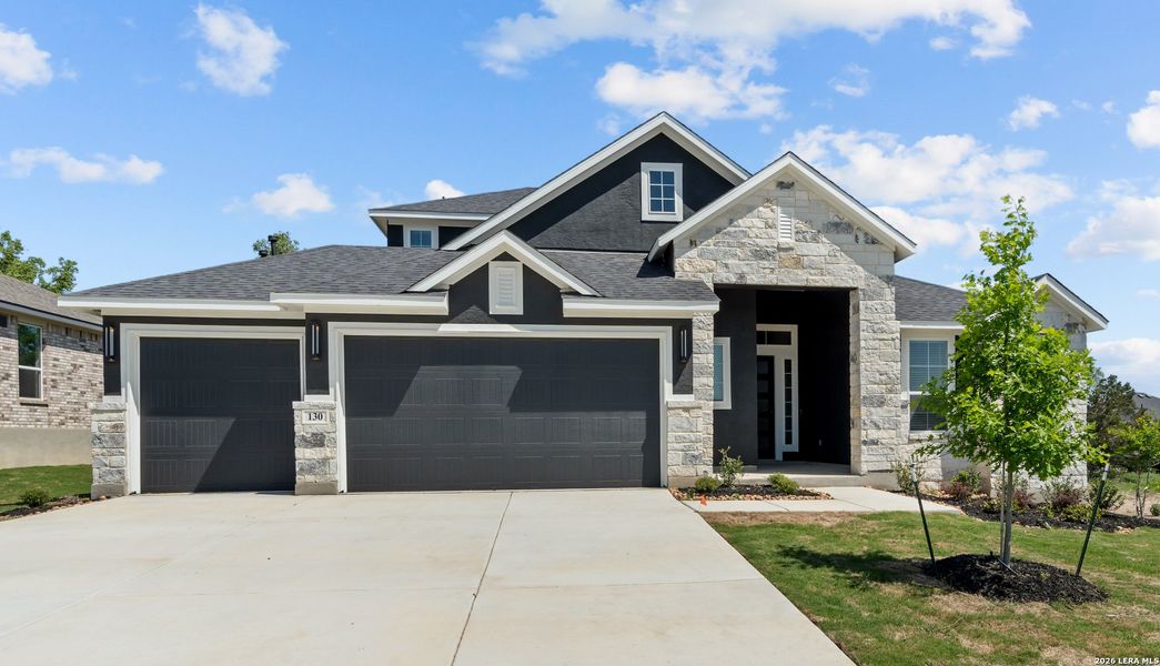 Front exterior of a new home in The Reserve at Potranco Oaks, Castroville, TX, highlighting curb appeal (Image 1). Front exterior of a new home in The Reserve at Potranco Oaks, Castroville, TX, highlighting curb appeal (Image 1).