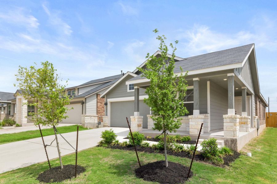 The property features a concrete driveway and an attached garage