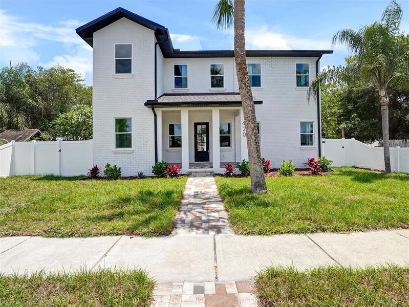 Front exterior of a new home in , St. Petersburg, FL, highlighting curb appeal (Image 1). Front exterior of a new home in , St. Petersburg, FL, highlighting curb appeal (Image 1).